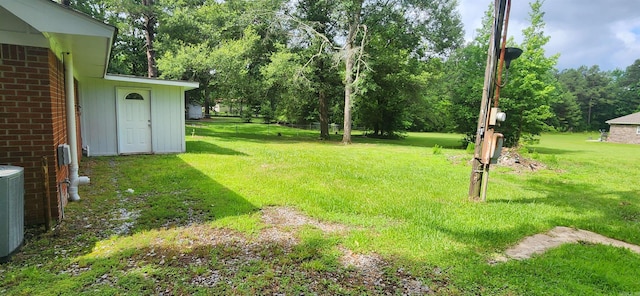 600 Robin Rd, White Hall, AR 71602 - view of green lawn featuring view of wooded area