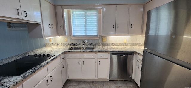 600 Robin Rd, White Hall, AR 71602 - kitchen with appliances with stainless steel finishes and white cabinetry
