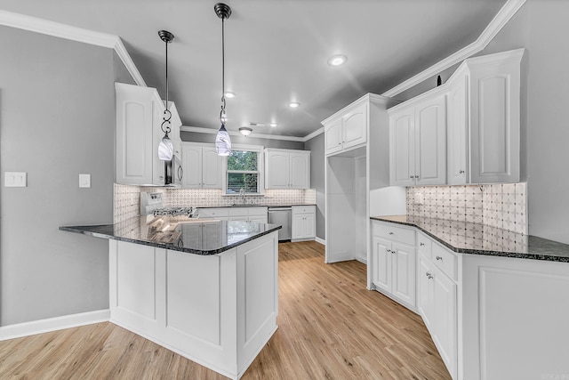 706 Greystone Blvd, Cabot, AR 72023 - kitchen with appliances with stainless steel finishes, a peninsula, dark stone countertops, light wood-style flooring, and recessed lighting