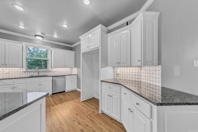 706 Greystone Blvd, Cabot, AR 72023 - kitchen featuring dishwasher, crown molding, dark stone counters, white cabinetry, and backsplash
