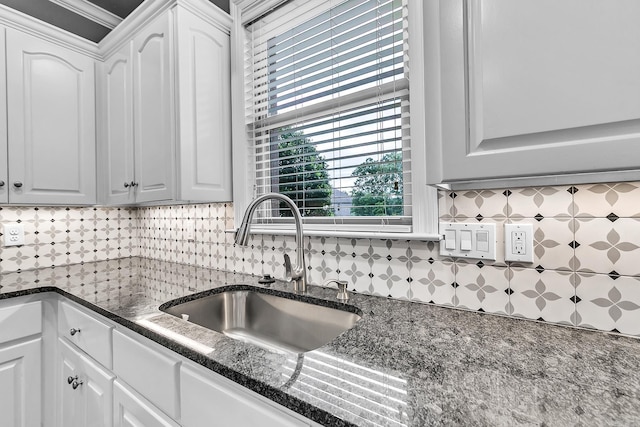 706 Greystone Blvd, Cabot, AR 72023 - kitchen with white cabinets, backsplash, and dark stone countertops