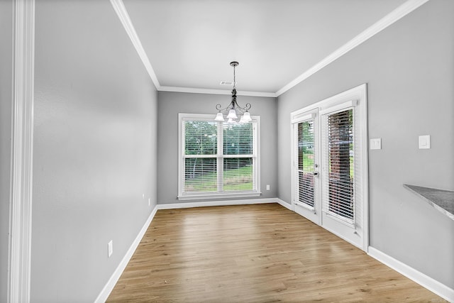 706 Greystone Blvd, Cabot, AR 72023 - unfurnished dining area with crown molding, french doors, plenty of natural light, a chandelier, and wood finished floors