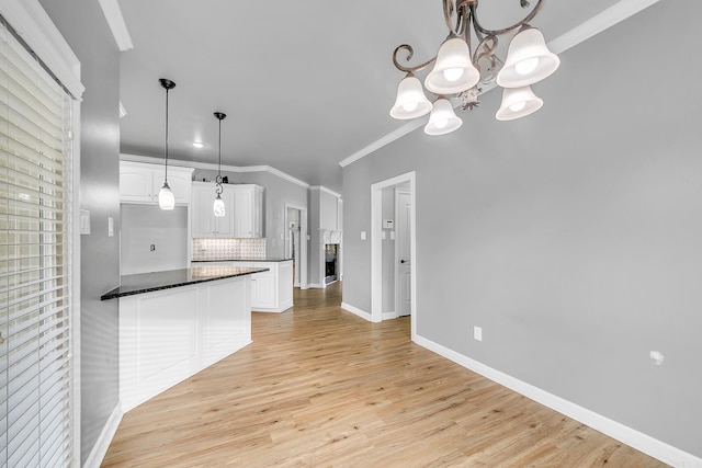 706 Greystone Blvd, Cabot, AR 72023 - kitchen with a chandelier, tasteful backsplash, white cabinetry, ornamental molding, and light wood finished floors