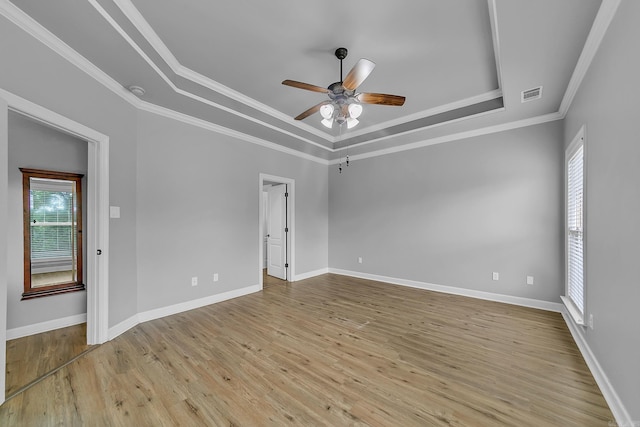 706 Greystone Blvd, Cabot, AR 72023 - unfurnished room with a tray ceiling, a ceiling fan, wood finished floors, and ornamental molding