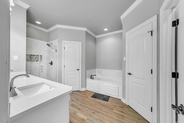 706 Greystone Blvd, Cabot, AR 72023 - full bath with a marble finish shower, a bath, recessed lighting, ornamental molding, and wood finished floors
