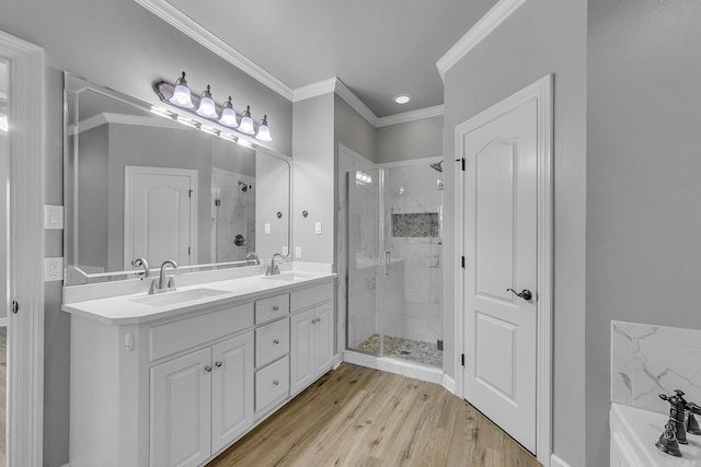 706 Greystone Blvd, Cabot, AR 72023 - bathroom with a shower stall, double vanity, wood finished floors, a garden tub, and crown molding