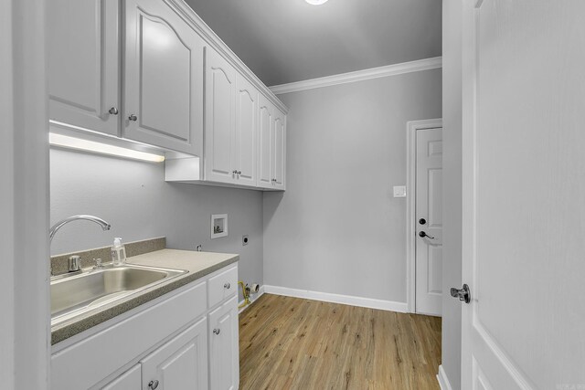706 Greystone Blvd, Cabot, AR 72023 - washroom with electric dryer hookup, ornamental molding, washer hookup, cabinet space, and light wood-type flooring