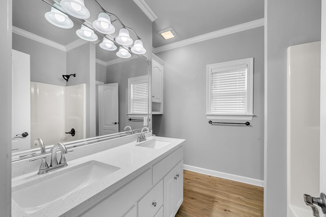 706 Greystone Blvd, Cabot, AR 72023 - full bath featuring crown molding, double vanity, a shower, and wood finished floors