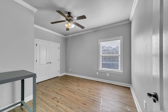 706 Greystone Blvd, Cabot, AR 72023 - unfurnished bedroom featuring ornamental molding, wood finished floors, a closet, and ceiling fan