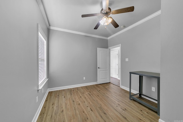 706 Greystone Blvd, Cabot, AR 72023 - empty room with wood finished floors, ornamental molding, ceiling fan, and a smoke detector