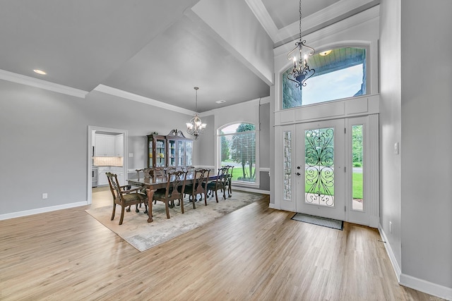 706 Greystone Blvd, Cabot, AR 72023 - dining space featuring a chandelier, ornamental molding, wood finished floors, a high ceiling, and recessed lighting