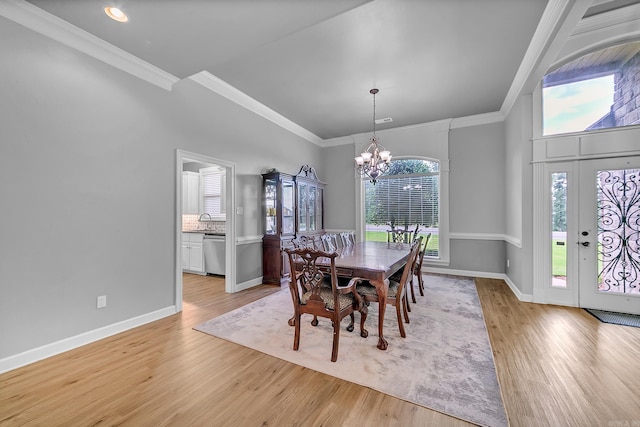 706 Greystone Blvd, Cabot, AR 72023 - dining space with a chandelier, light wood finished floors, and ornamental molding