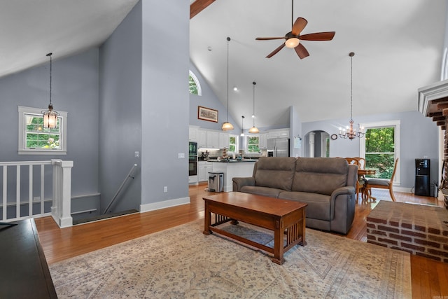 175 Appaloosa Trl, Hot Springs, AR 71909 - living room with high vaulted ceiling, light wood finished floors, ceiling fan, and a chandelier