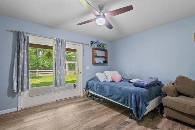 175 Appaloosa Trl, Hot Springs, AR 71909 - bedroom featuring access to exterior, wood finished floors, and ceiling fan