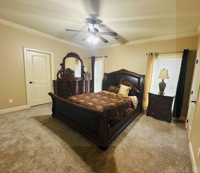14 Longwell Loop, Little Rock, AR 72211 - bedroom featuring carpet, multiple windows, ornamental molding, and a ceiling fan