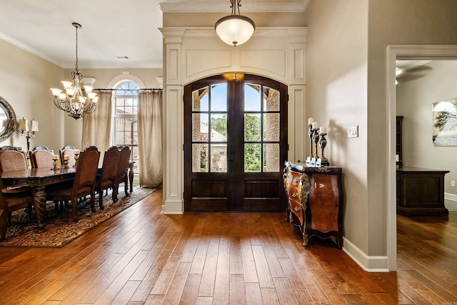 14 Longwell Loop, Little Rock, AR 72211 - foyer entrance featuring wood-type flooring, a chandelier, ornamental molding, and arched walkways