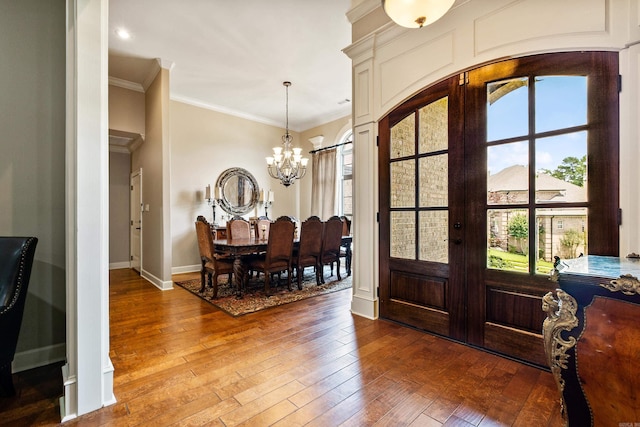 14 Longwell Loop, Little Rock, AR 72211 - entryway with french doors, a chandelier, arched walkways, hardwood / wood-style flooring, and ornamental molding