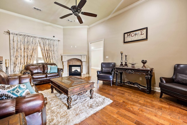 14 Longwell Loop, Little Rock, AR 72211 - living room with a ceiling fan, ornamental molding, hardwood / wood-style floors, and a multi sided fireplace