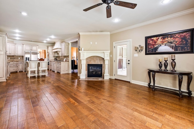 14 Longwell Loop, Little Rock, AR 72211 - living area featuring ceiling fan, dark wood-style flooring, ornamental molding, a tiled fireplace, and recessed lighting