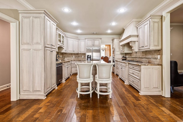 14 Longwell Loop, Little Rock, AR 72211 - kitchen featuring stainless steel appliances, ornamental molding, tasteful backsplash, dark wood finished floors, and custom range hood