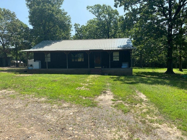 564 Polk Road 74, Mena, AR 71953 - view of front of home featuring a front yard, a metal roof, and a sunroom