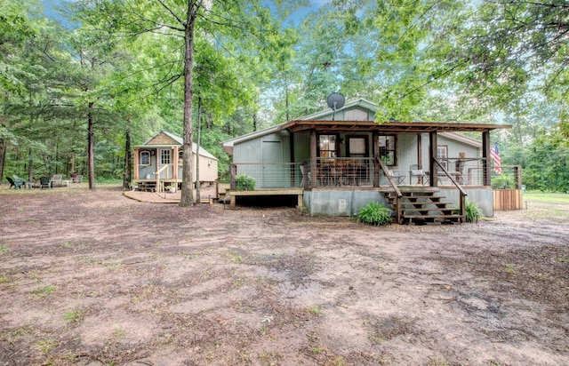 164 Roxie Ln, Greers Ferry, AR 72067 - view of front of property featuring an outdoor structure and a porch