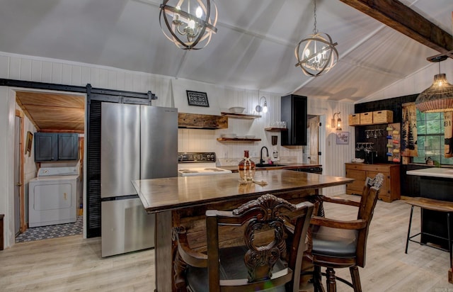 164 Roxie Ln, Greers Ferry, AR 72067 - kitchen featuring washer / clothes dryer, freestanding refrigerator, range with electric cooktop, light wood-style floors, and wooden walls