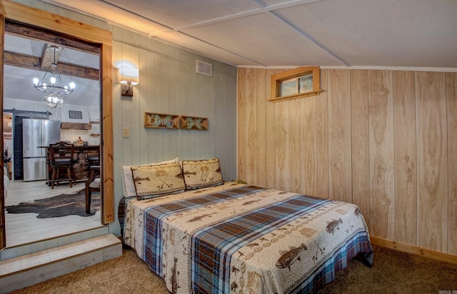 164 Roxie Ln, Greers Ferry, AR 72067 - bedroom with freestanding refrigerator, a chandelier, carpet, and wooden walls