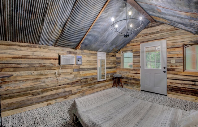 164 Roxie Ln, Greers Ferry, AR 72067 - bedroom featuring wooden walls, lofted ceiling, a wall mounted AC, and a chandelier