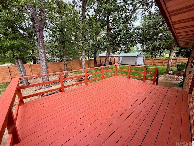1711 Lonoke Rd, Mountain Home, AR 72653 - deck featuring a fenced backyard, a garage, and a shed