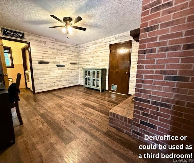 1711 Lonoke Rd, Mountain Home, AR 72653 - living room with ceiling fan, a textured ceiling, and dark wood-type flooring