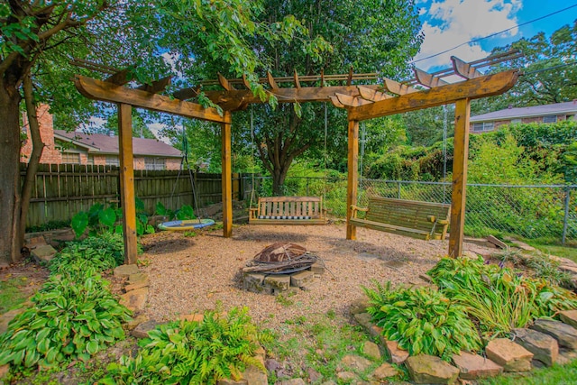 3 Sonata Trl, Little Rock, AR 72205 - fenced backyard featuring an outdoor fire pit and a pergola