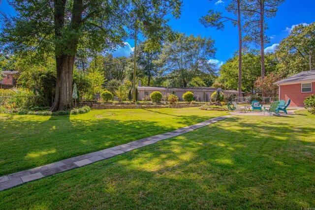 3 Sonata Trl, Little Rock, AR 72205 - view of yard with an outdoor fire pit and a patio area