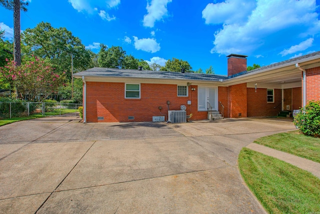 3 Sonata Trl, Little Rock, AR 72205 - back of property with crawl space, entry steps, concrete driveway, brick siding, and a chimney
