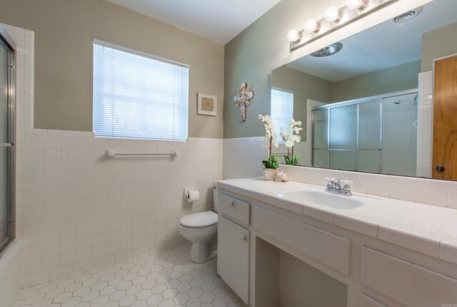 3 Sonata Trl, Little Rock, AR 72205 - full bathroom with tile patterned floors, tile walls, vanity, a shower with shower door, and wainscoting