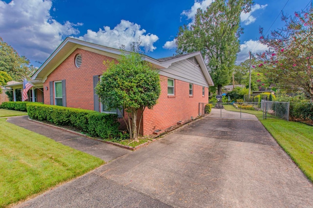 3 Sonata Trl, Little Rock, AR 72205 - view of side of property featuring brick siding, concrete driveway, and a gate