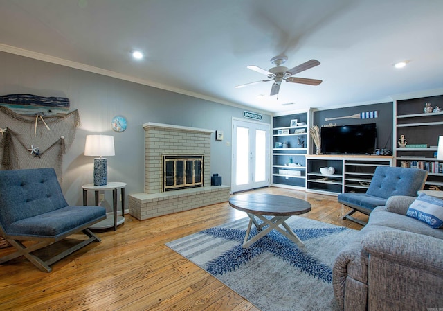 3 Sonata Trl, Little Rock, AR 72205 - living area featuring crown molding, wood-type flooring, ceiling fan, a fireplace, and recessed lighting