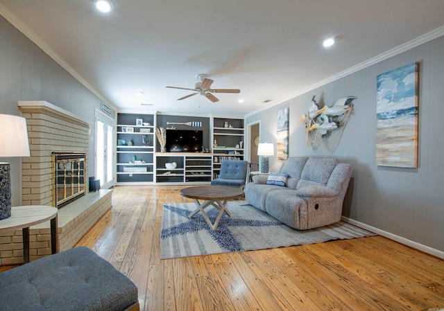 3 Sonata Trl, Little Rock, AR 72205 - living room featuring hardwood / wood-style floors, a brick fireplace, ornamental molding, ceiling fan, and recessed lighting
