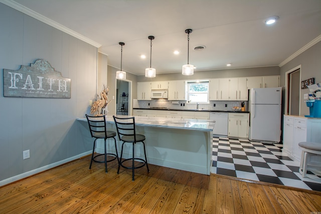 3 Sonata Trl, Little Rock, AR 72205 - kitchen with white appliances, crown molding, a peninsula, white cabinetry, and tasteful backsplash