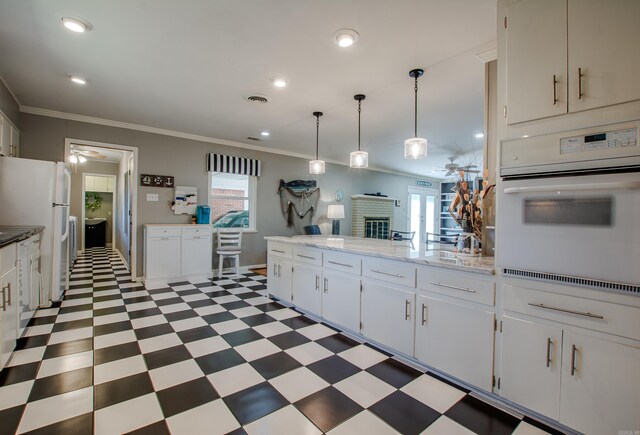3 Sonata Trl, Little Rock, AR 72205 - kitchen featuring white appliances, light flooring, ornamental molding, white cabinets, and pendant lighting