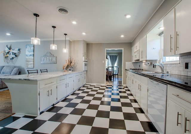 3 Sonata Trl, Little Rock, AR 72205 - kitchen featuring white appliances, a peninsula, dark flooring, crown molding, and decorative backsplash