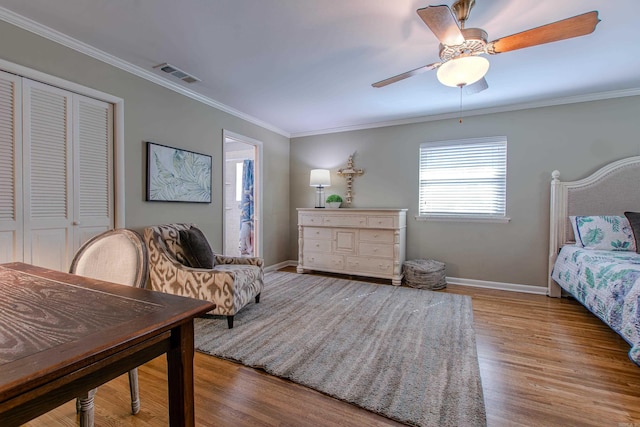 3 Sonata Trl, Little Rock, AR 72205 - bedroom featuring wood finished floors, crown molding, a closet, and a ceiling fan