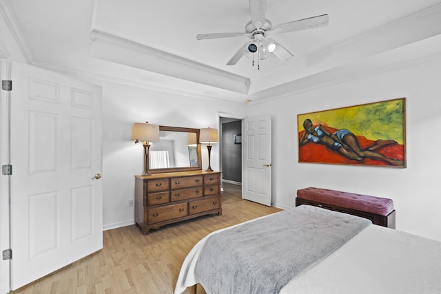 1323 Starfield, North Little Rock, AR 72116 - bedroom with a tray ceiling, crown molding, light wood finished floors, and ceiling fan
