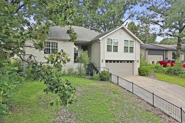 1323 Starfield, North Little Rock, AR 72116 - view of front of home with brick siding, driveway, and a garage