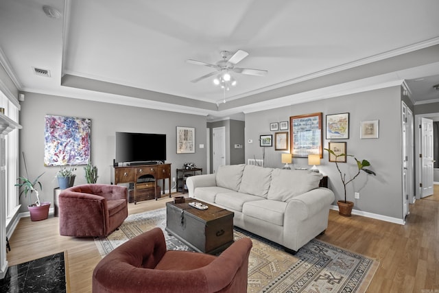 1323 Starfield, North Little Rock, AR 72116 - living room featuring a tray ceiling, ceiling fan, wood finished floors, and crown molding