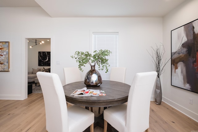 11325 Jamestown Dr, Little Rock, AR 72211 - dining room with light wood-type flooring and baseboards