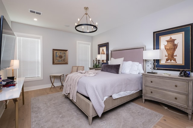 11325 Jamestown Dr, Little Rock, AR 72211 - bedroom with a chandelier, light wood finished floors, and recessed lighting