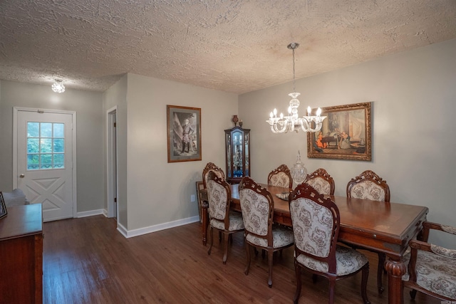 3209 Jack Mann Rd, Little Rock, AR 72210 - dining room featuring a chandelier, wood finished floors, and a textured ceiling