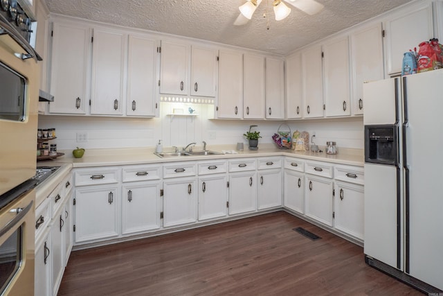 3209 Jack Mann Rd, Little Rock, AR 72210 - kitchen featuring white fridge with ice dispenser, oven, white cabinetry, light countertops, and a ceiling fan