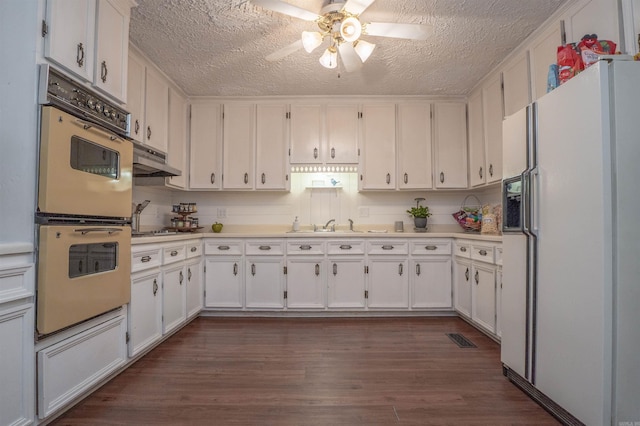 3209 Jack Mann Rd, Little Rock, AR 72210 - kitchen featuring white appliances, ceiling fan, a textured ceiling, and white cabinets